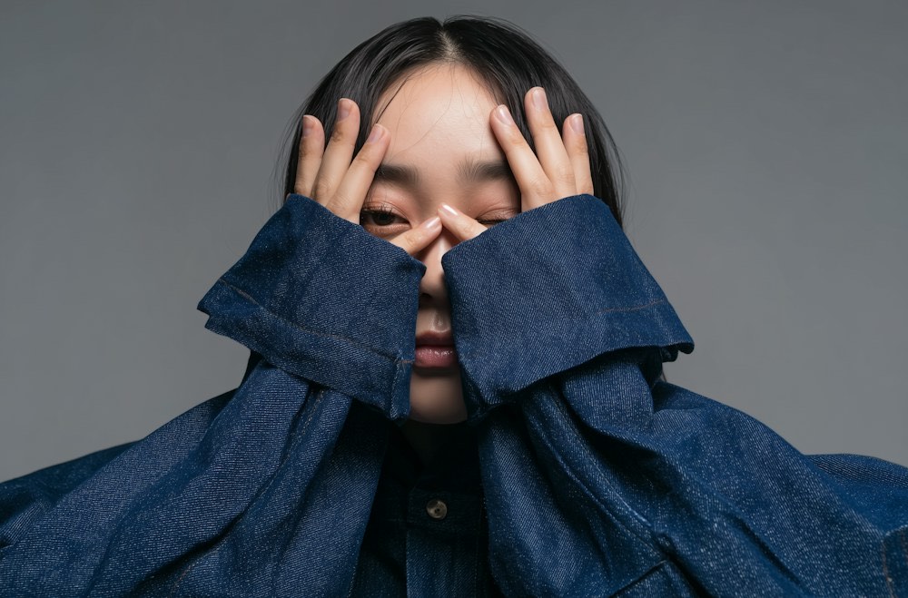 Tidewell Denim Co. campaign image: a model in an oversized dark-wash denim jacket